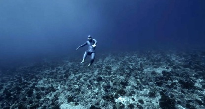 Freediver Guillaume Nery carried by swift ocean currents off Tahiti, undated/still image from video by Christopher Jobson, ThisIsCollosal.com/click to see more 